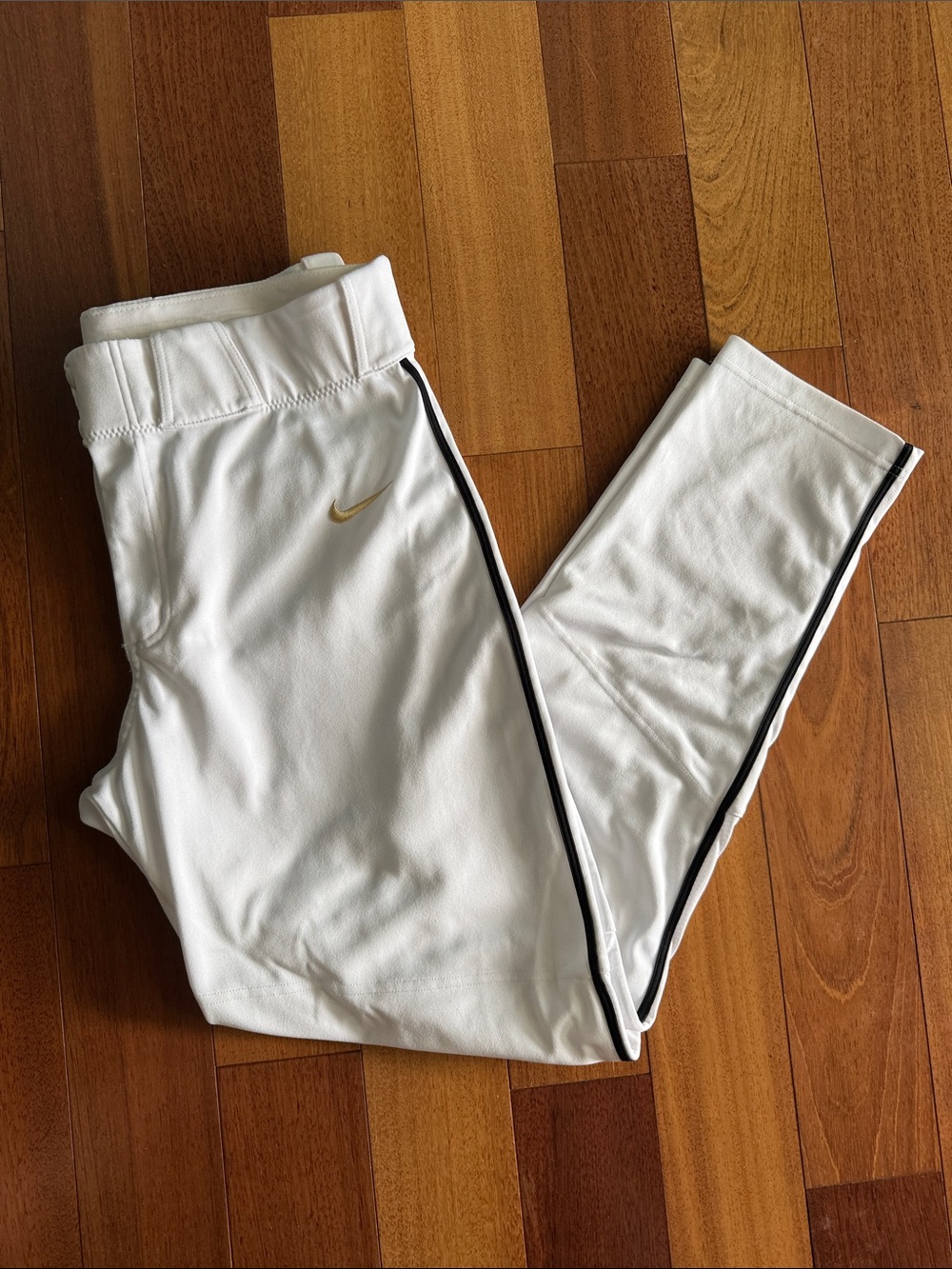 Nike White baseball pants with Black piping and Gold Swoosh